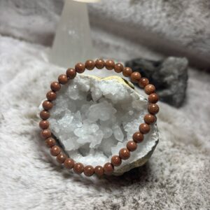 Armband - goudsteen rood kogel 6 mm